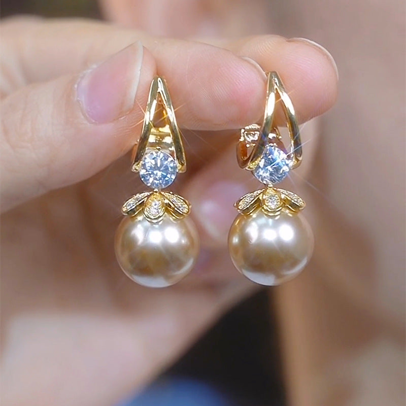 Pendientes de plata con perlas de lujo francés de nuevo estilo 2025
