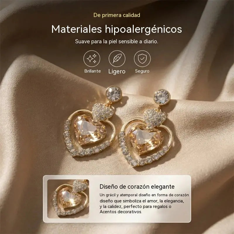 👑✨【¡Compra uno y llévate otro gratis! 】Pendientes colgantes de doble corazón brillantes para mujer.
